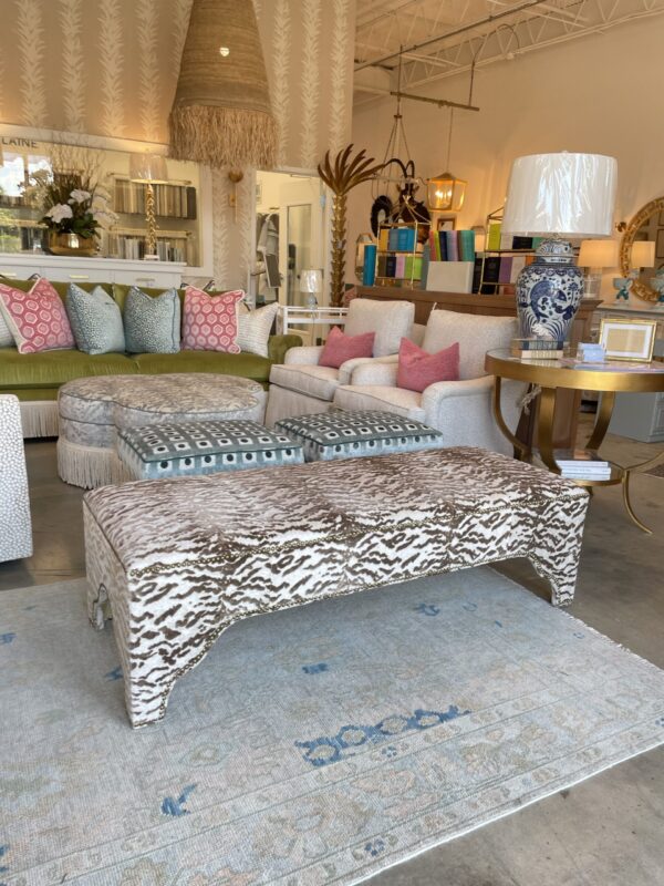 Kai rectangle ottoman in a light brown faux zebra fabric! Love the nail head detailing