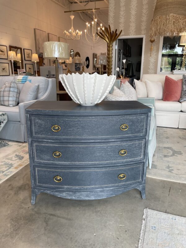 Dark blue modern history bow front chest and gold hardware! One available