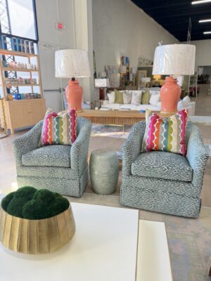 Set of (2) swivel rock Barrel Chairs $2400 each fabric: capital teal 2
