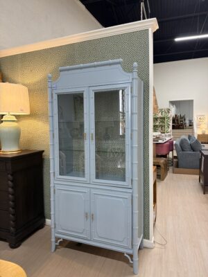 Vintage lacquered China cabinet Dixie aloha with Thibaut wallpaper in the back and glass shelves