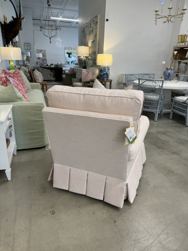 Single pink swivel rock, pleaded skirt chair, covered in inside out, pink performance fabric with a white welt!  Would be amazing in a nursery! - Image 2