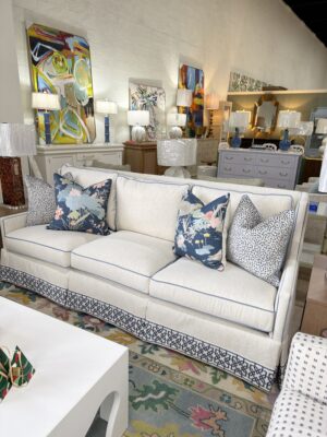 Massoud Grier sofa covered in performance velvet nomad snow with a blue welt and blue tape trim!