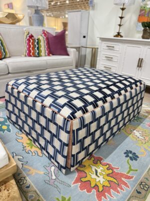 Lilly large rectangular skirted ottoman in Ocelot blue with a light orange under skirt and welding