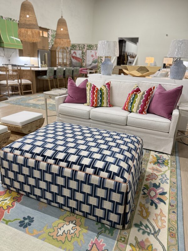 Lilly large rectangular skirted ottoman in Ocelot blue with a light orange under skirt and welding - Image 3