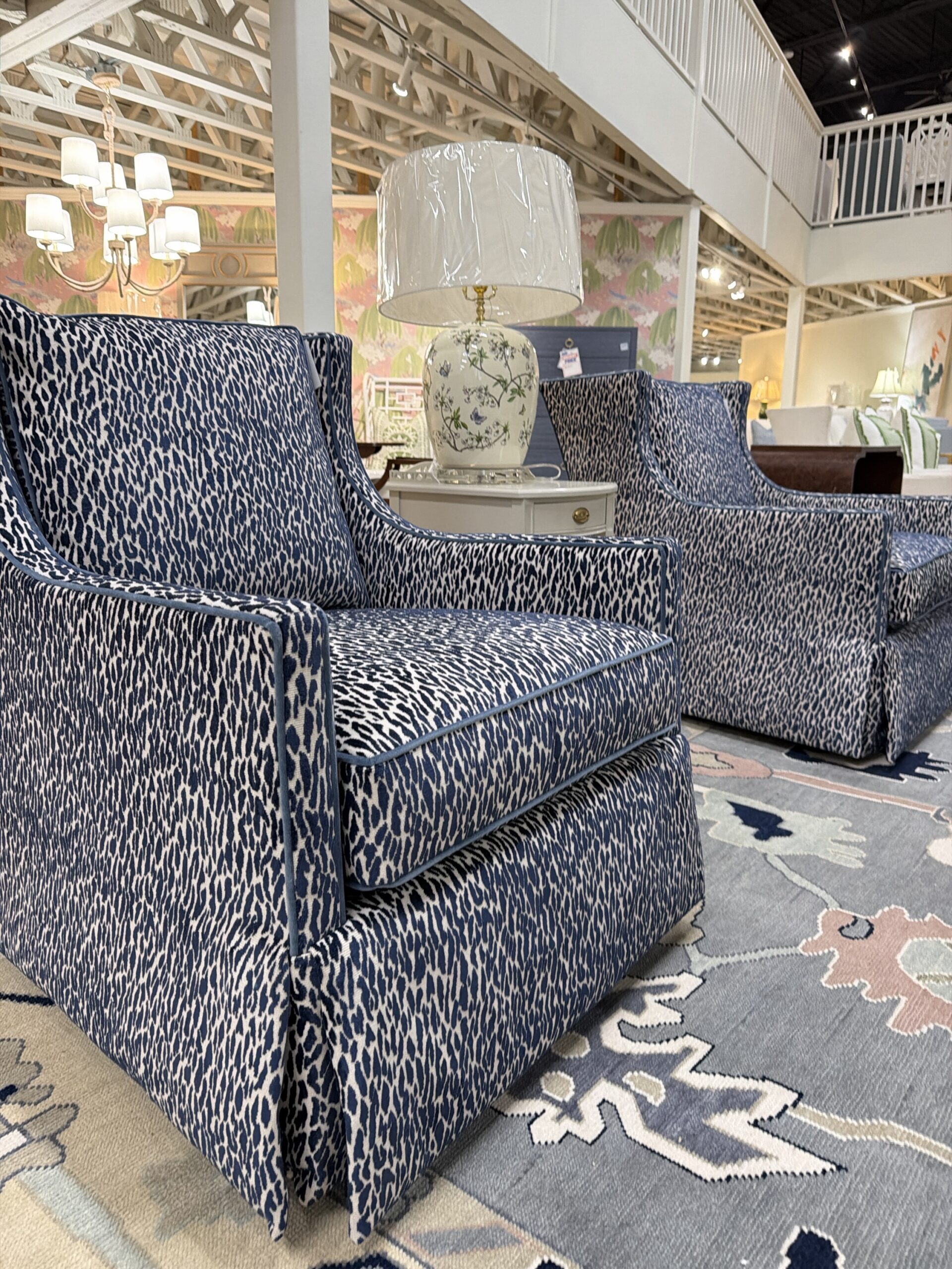 Grier skirted swivel and rock chair set covered in fleck midnight with a blue welt ! - $2750 each!