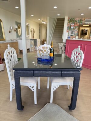 Navy grass cloth mingfoot game table with drawers and glass top