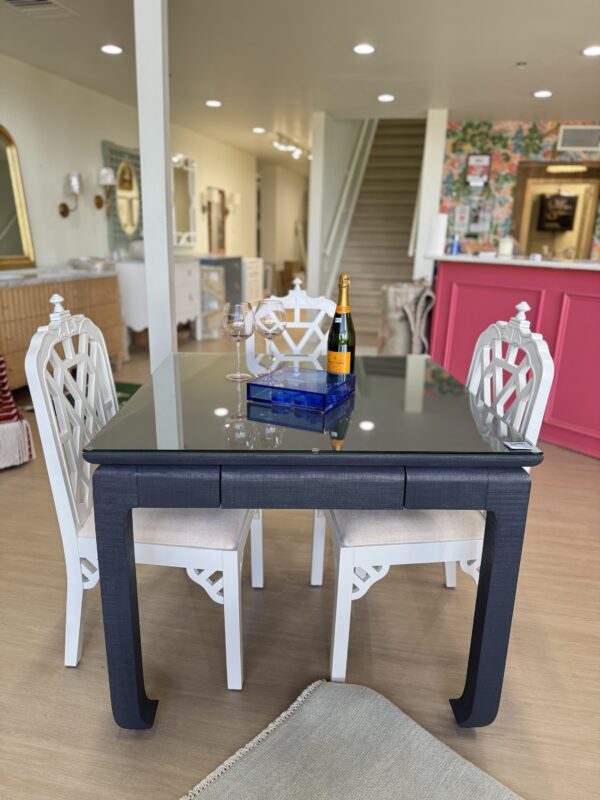 Navy grass cloth mingfoot game table with drawers and glass top