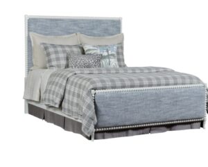 King spool bed in a white wooden finish with blue upholstered fabric, headboard, and footboard