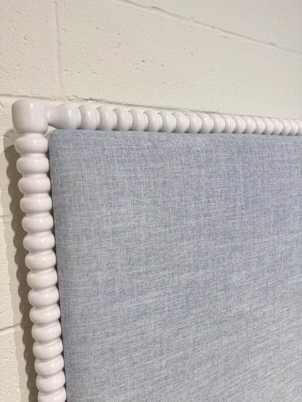 King spool bed in a white wooden finish with blue upholstered fabric, headboard, and footboard - Image 8