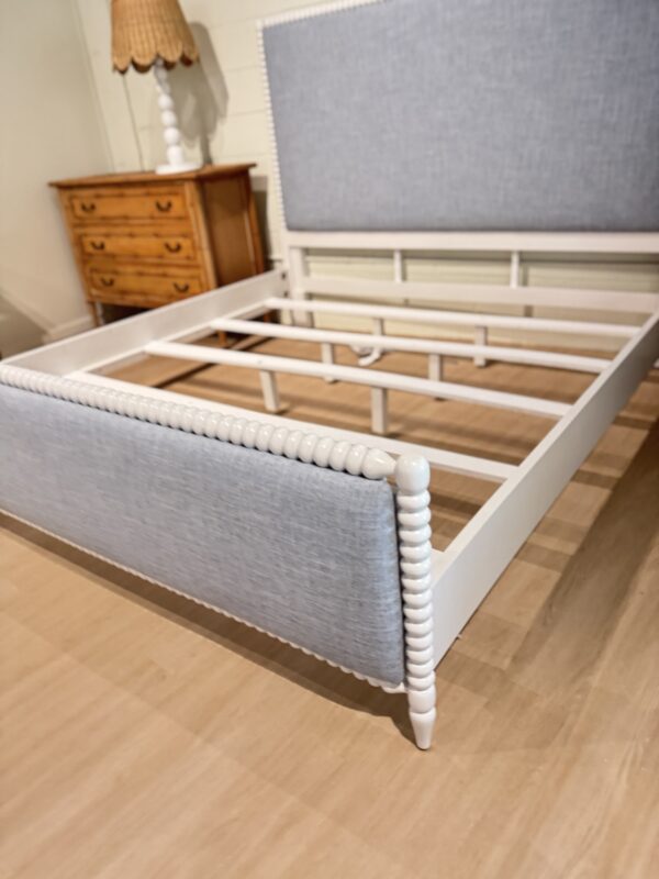 King spool bed in a white wooden finish with blue upholstered fabric, headboard, and footboard - Image 6