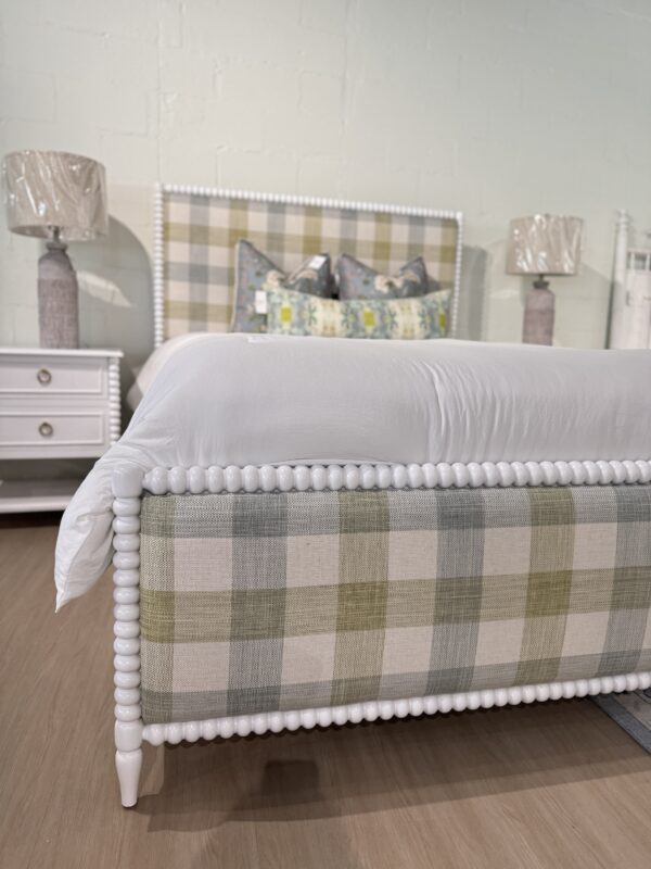 Queen spool bed in a white wooden finish with green blue and neutral gingham upholstered fabric, headboard, and footboard - Image 2