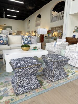 Set of Q ottomans covered in fleck midnight with brass nailheads