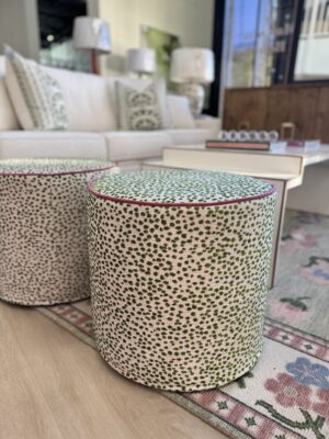 Cylinder ottoman set covered in Lizzie Verde with hot pink welting! Sold as a set of 2