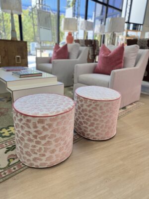 Cylinder ottoman set covered in pink fizz with hot pink welting! Sold as a set of 2