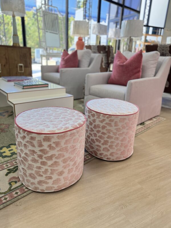 Cylinder ottoman set covered in pink fizz with hot pink welting! Sold as a set of 2