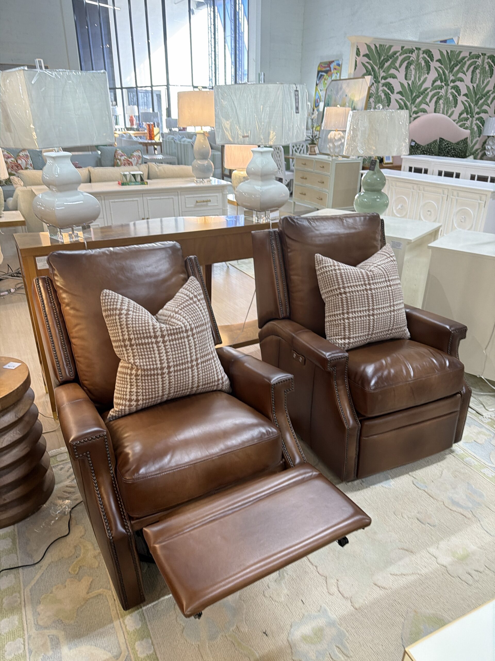 ELECTRIC RECLINER SET! These swivel rock & recliner $2300 EACH- must be plugged in and these include a USBC port to charge your phone! Covered in brown leather!