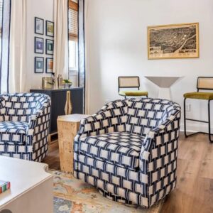 Carley swivel chair set covered in Wyndham indigo