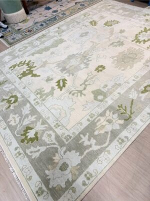 8x10 muted green toned Turkish oushack rug