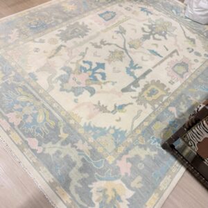 8x10 muted toned Turkish oushack rug