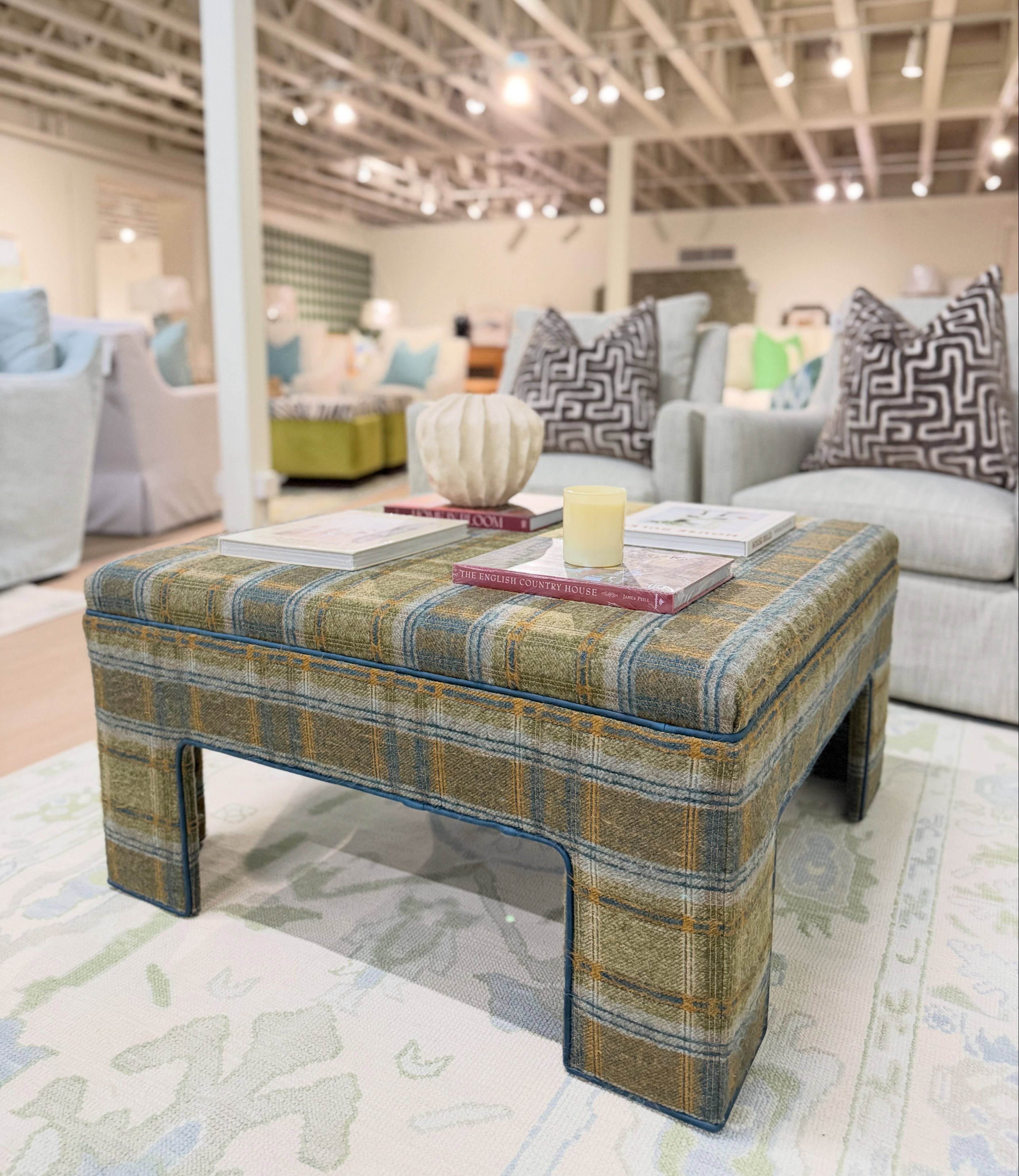 Scott Square ottoman covered in cabin plaid moss welted in Ellis navy