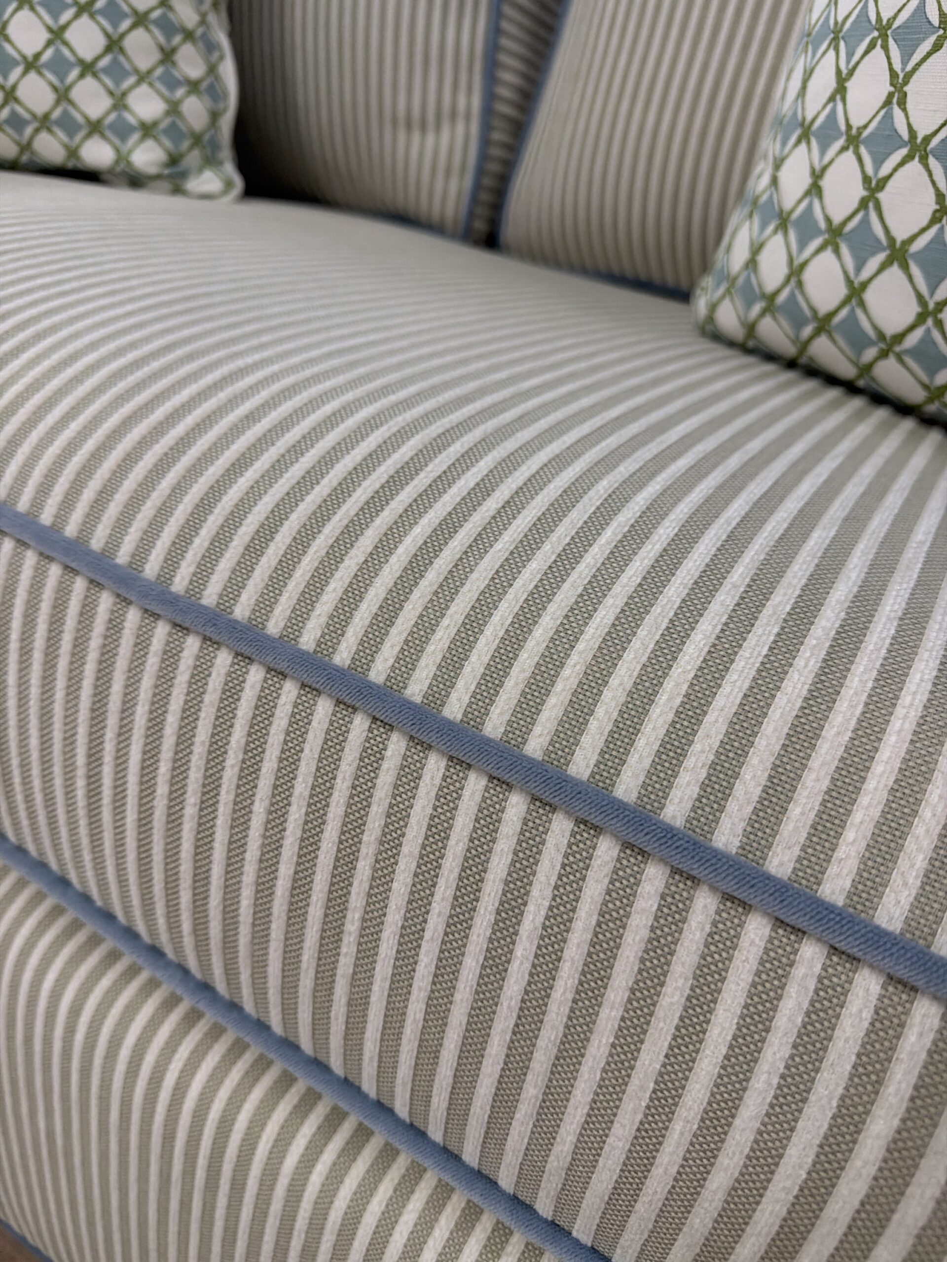 Mila sofa covered in performance fabric sunbrella fern with blue welt - Image 3
