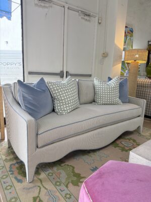 Mila sofa covered in performance fabric sunbrella fern with blue welt