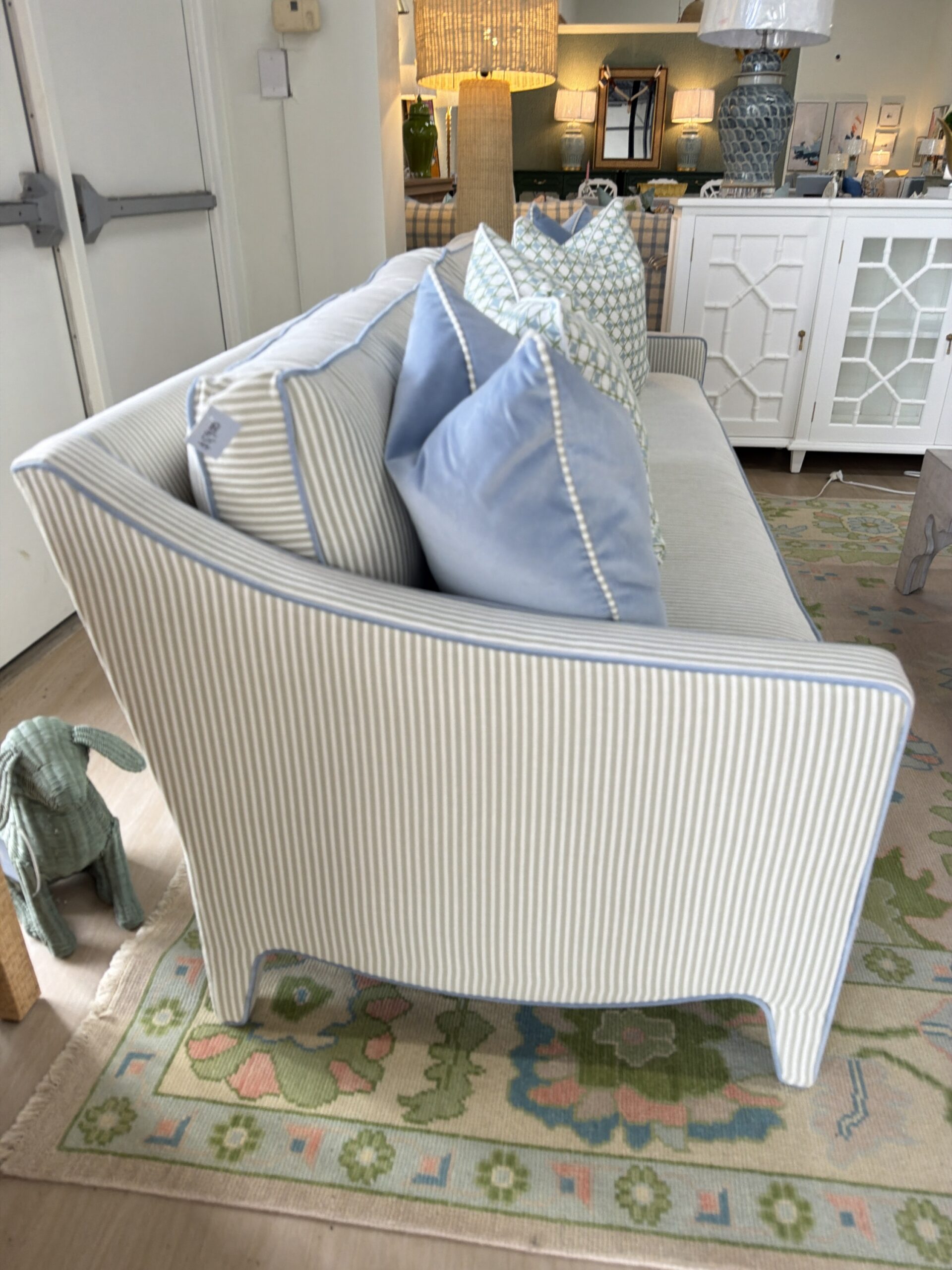 Mila sofa covered in performance fabric sunbrella fern with blue welt - Image 2
