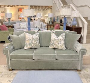 Cameron Greek key sofa covered in performance velvet sage green with white welt